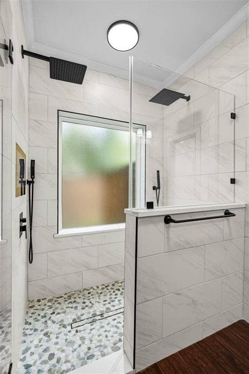 2705 Ithaca Court, Plano, TX 75025 Walk-in shower with dual matte black rainfall shower heads, pebble-finish flooring, and white tile surround