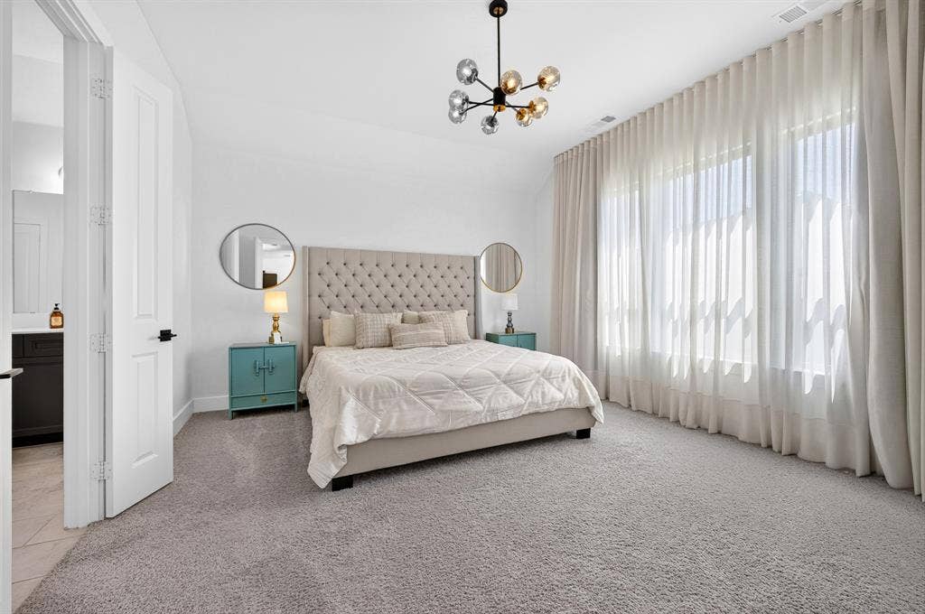 2809 Buckskin Lane, Northlake, TX 76247 White interior walls with a contemporary chandelier and wall-to-wall carpeting
