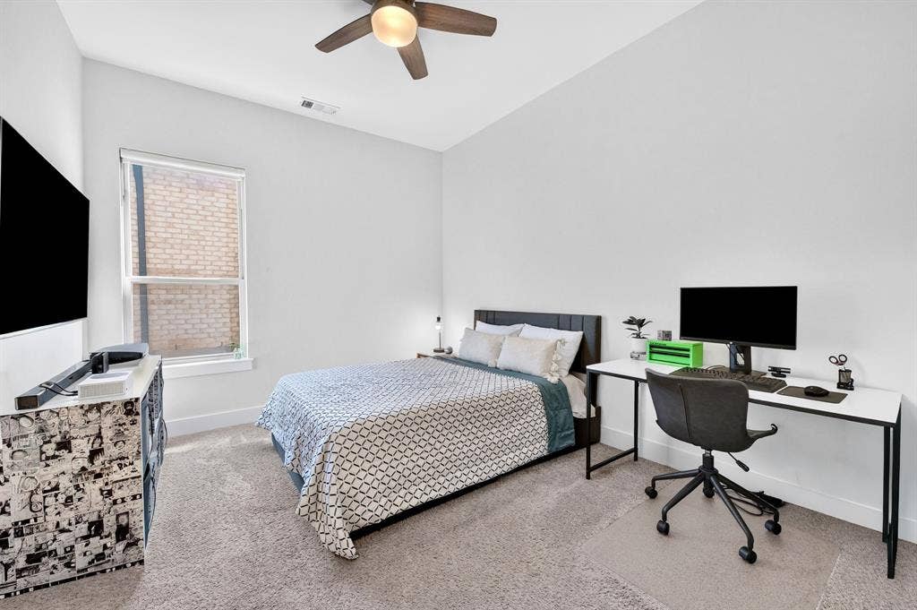 2809 Buckskin Lane, Northlake, TX 76247 Carpeted room with high vaulted ceilings, a ceiling fan, and a single window