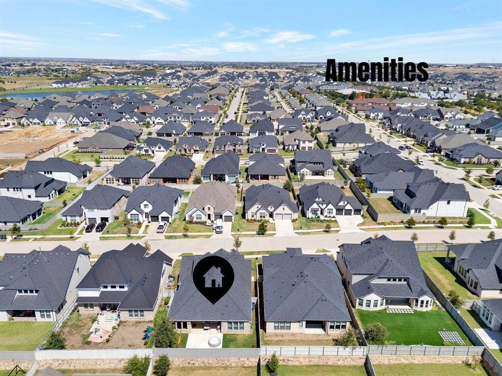 2809 Buckskin Lane, Northlake, TX 76247 Aerial perspective of a developed residential community featuring numerous single-family homes with dark-toned roofs