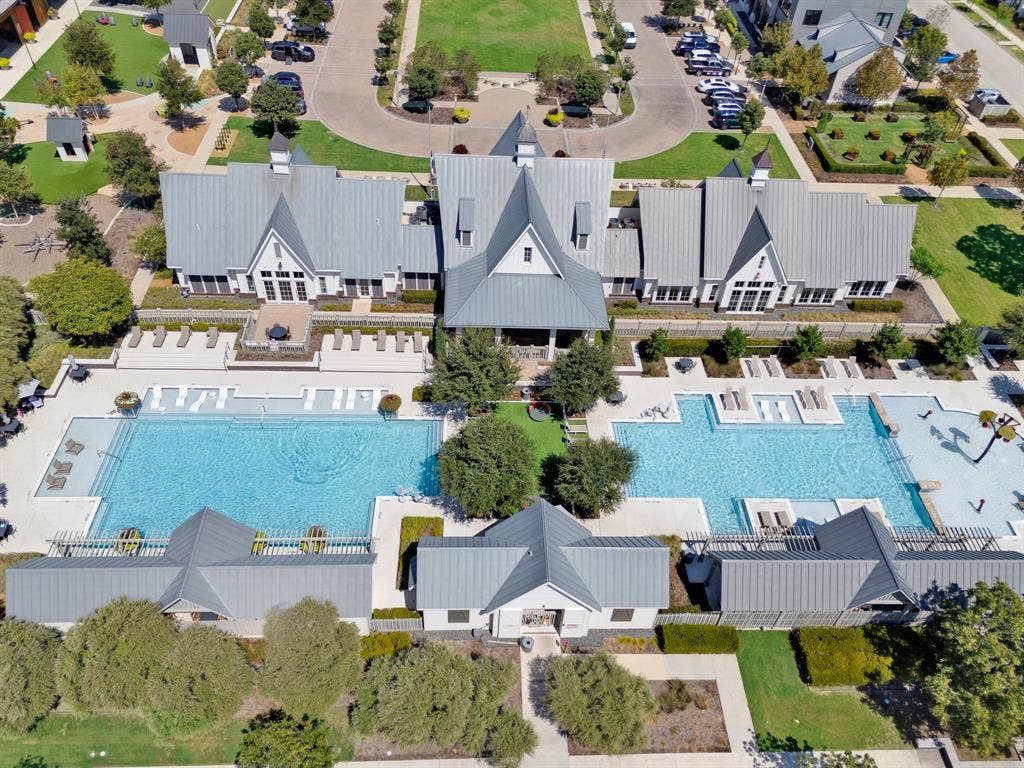 2809 Buckskin Lane, Northlake, TX 76247 Expansive community pool area featuring a large rectangular pool, a curved pool, and multiple lounge areas