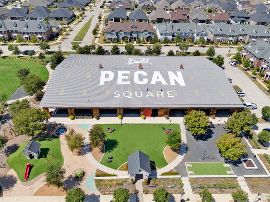 2809 Buckskin Lane, Northlake, TX 76247 Large-scale building with a metal roof and prominent branding, surrounded by residential properties
