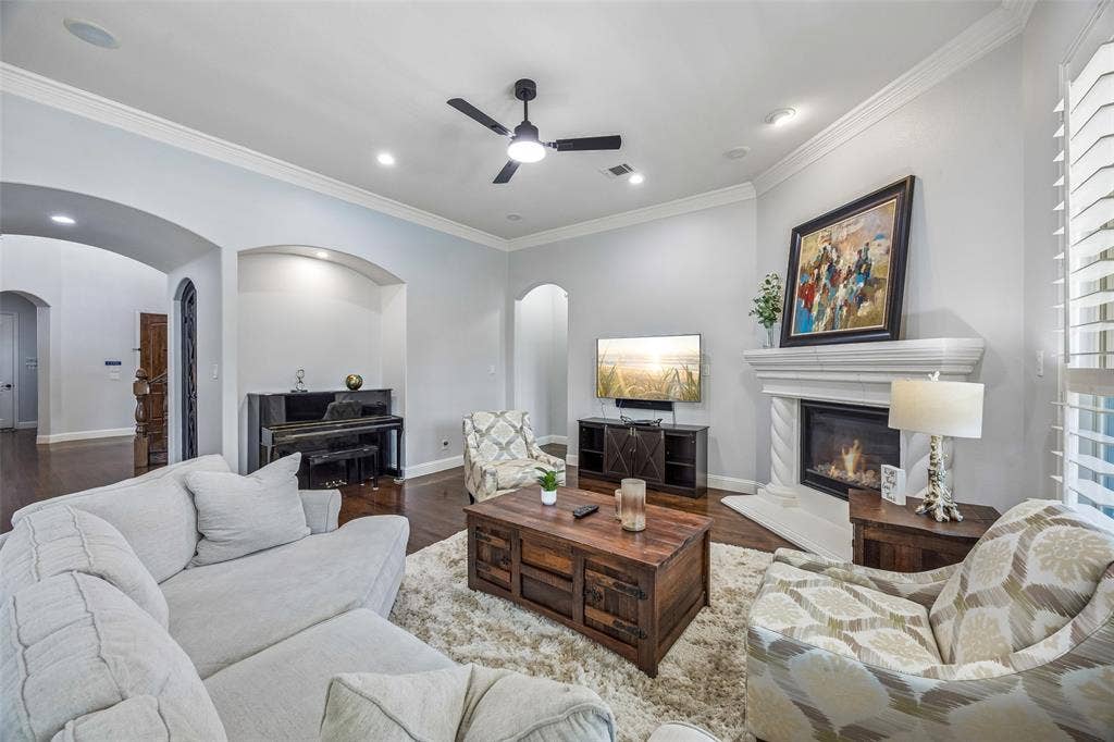 Living room is flanked by the kitchen and view to gardens