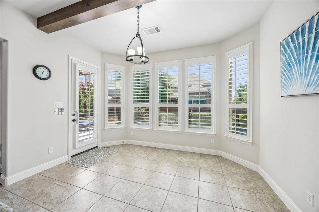 Bay windows flank the second dining area