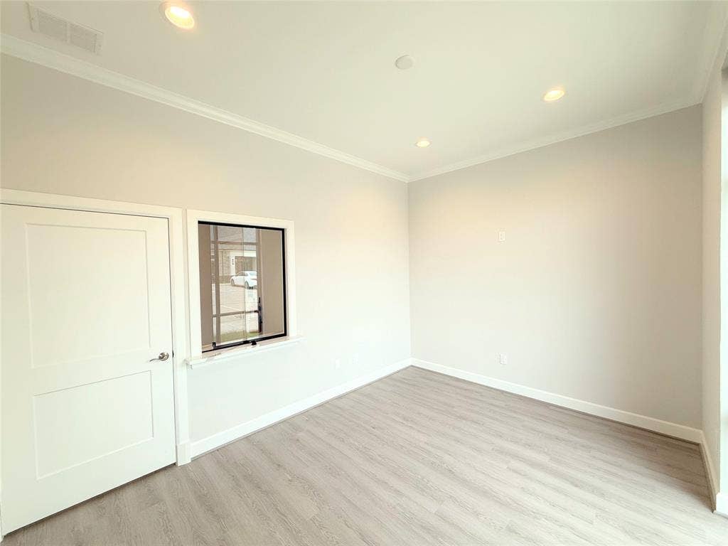 2120 Prairie Drive, #901, Prosper, TX 75078 Recessed lighting, crown molding, light wood-finish flooring, two-panel interior door, and a transom window