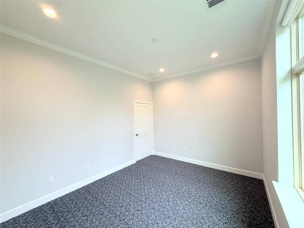 2120 Prairie Drive, #902, Prosper, TX 75078 Recessed lighting, patterned carpeting, crown molding, white trim, and a window with white casing