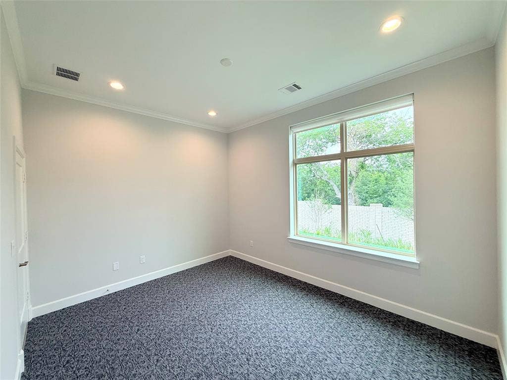 2120 Prairie Drive, #902, Prosper, TX 75078 Recessed lighting fixtures, crown molding, large multi-pane window, wall-to-wall carpeting, and a flat-panel door
