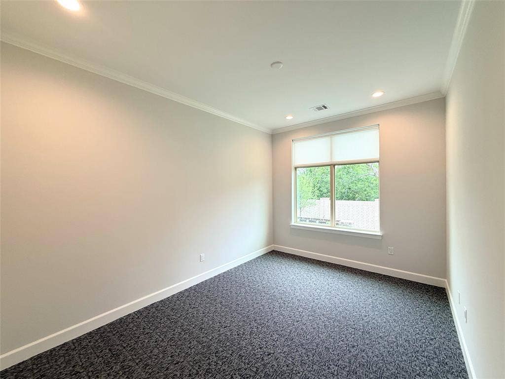 2120 Prairie Drive, #902, Prosper, TX 75078 Recessed lighting, crown molding, gray textured carpeting, and a window with a roller shade
