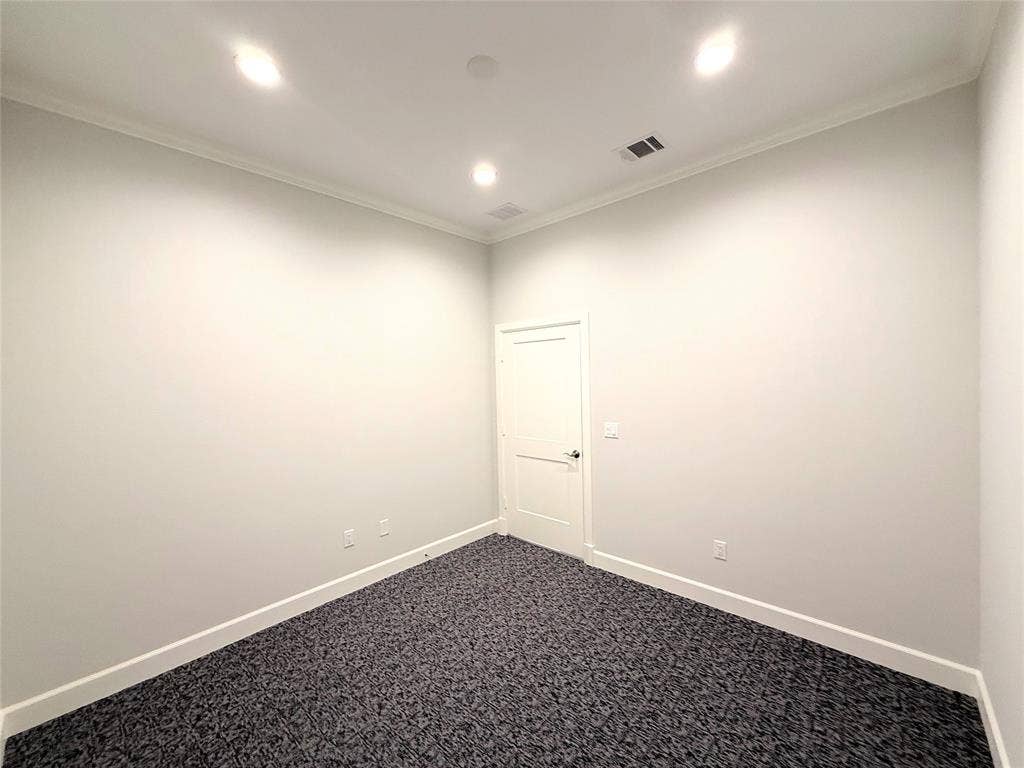 2120 Prairie Drive, #902, Prosper, TX 75078 Recessed ceiling lighting, crown molding, white painted walls, patterned carpet flooring, and a flat-panel interior door