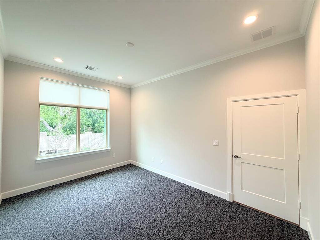 2120 Prairie Drive, #902, Prosper, TX 75078 Recessed lighting with crown molding, light gray walls, dark patterned carpeting, and a two-panel interior door