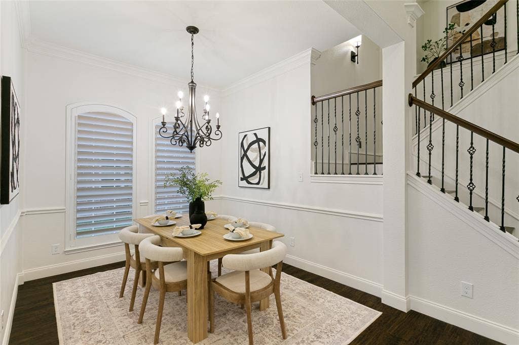 17 Adams Court, Mansfield, TX 76063 Dark wood-finish flooring with a decorative area rug, complemented by decorative wainscoting and crown molding