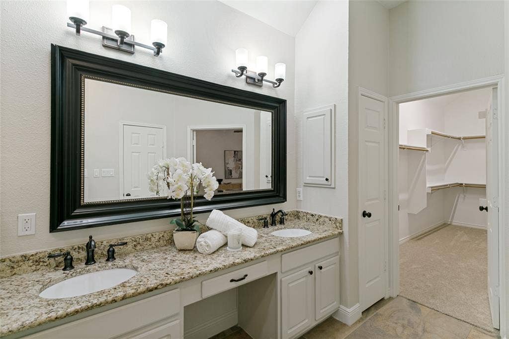 17 Adams Court, Mansfield, TX 76063 Double vanity with granite-style countertop, dual undermount sinks, and oil-rubbed bronze fixtures