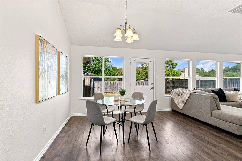1110 Harvard Lane, Allen, TX 75002 Vaulted ceiling, wood-finish flooring, multiple windows, and a rear exterior door