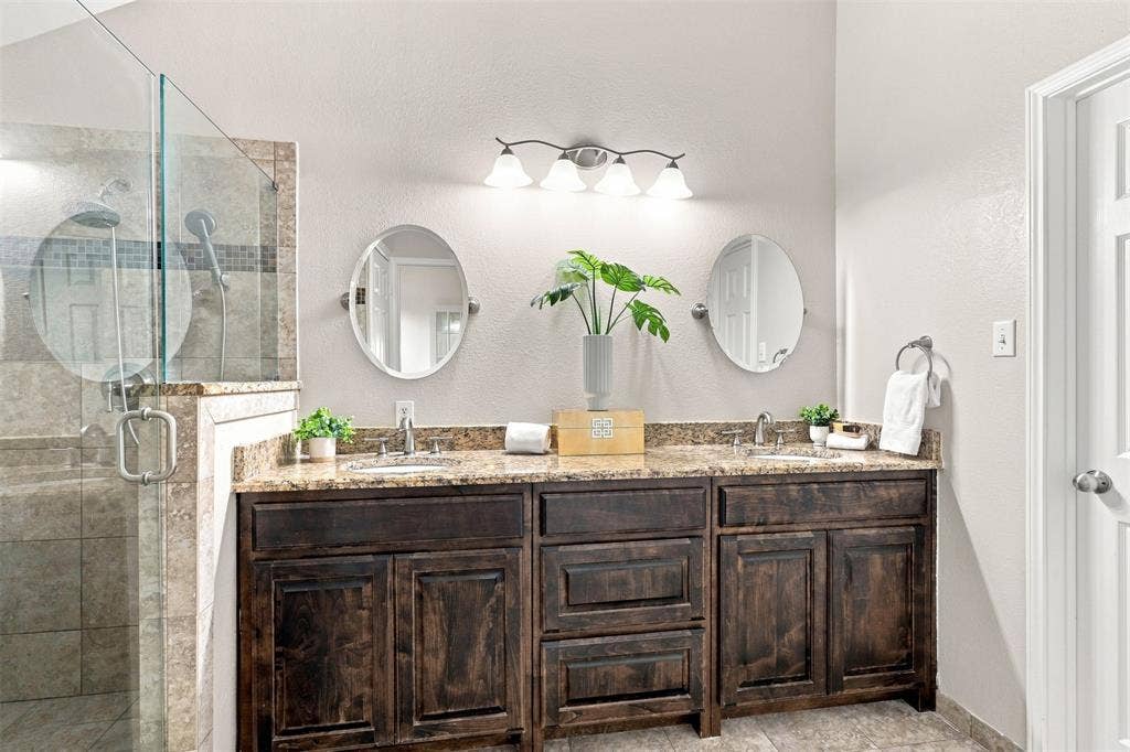 1110 Harvard Lane, Allen, TX 75002 Primary Bathroom updated 2017, Freshly painted 2026. Counter height Cabinets.
