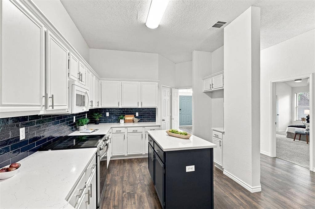 1110 Harvard Lane, Allen, TX 75002 Kitchen has plenty of cabinets and storage for all your cooking needs.