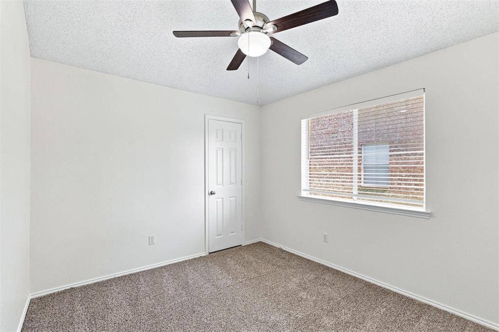 1110 Harvard Lane, Allen, TX 75002 Secondary bedroom, vaulted ceiling, fan and window.