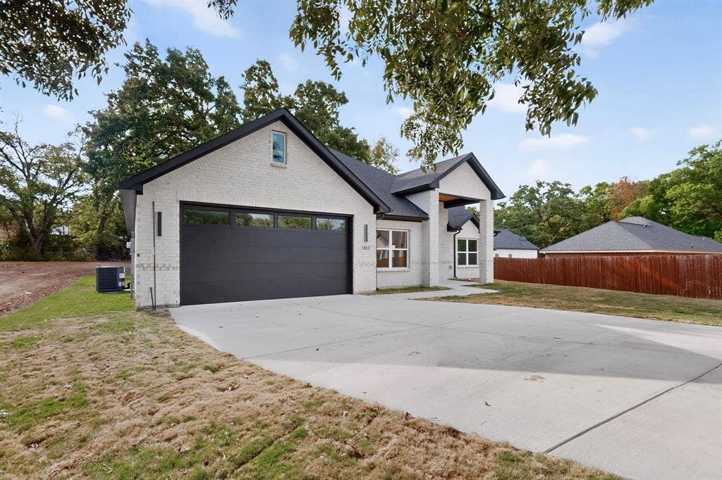Contemporary architecture with a white brick exterior and a contrasting black roof