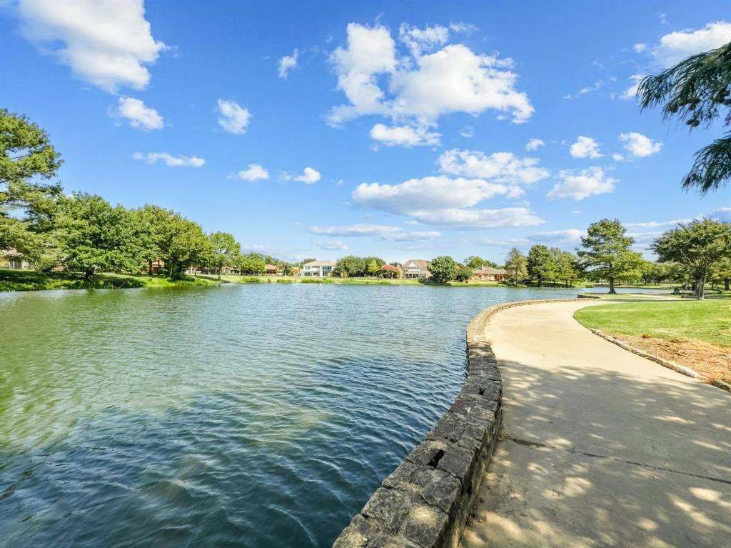 14800 Enterprise Drive, #14B, Farmers Branch, TX 75234 pond with walking trails, benches and bench swings