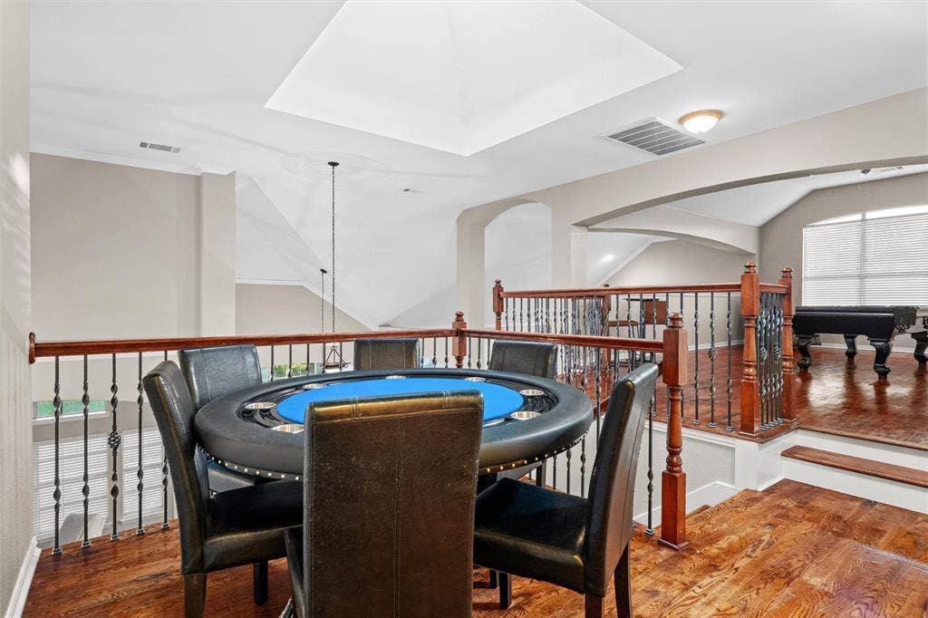 Unique multi level game room creates the perfect space for game nights and entertaining.