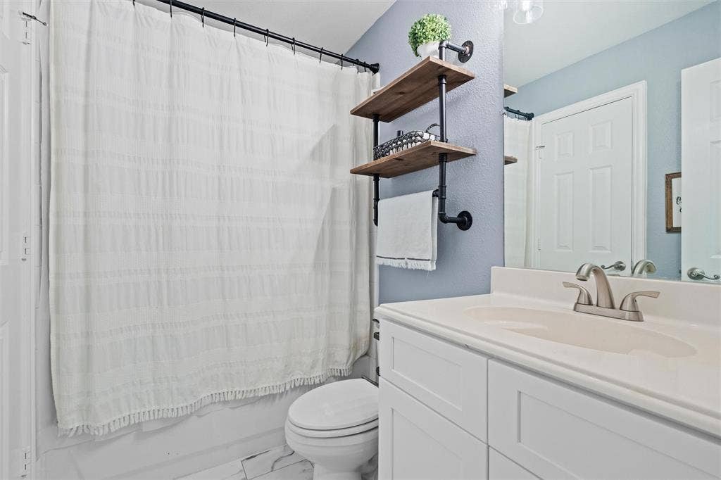 Upstairs hall bath updated with new cabinet July 2026