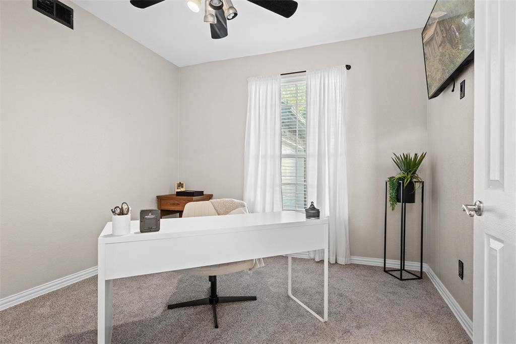 Dedicated home office with natural light and a quiet setting ideal for remote work, studying, or creative pursuits.