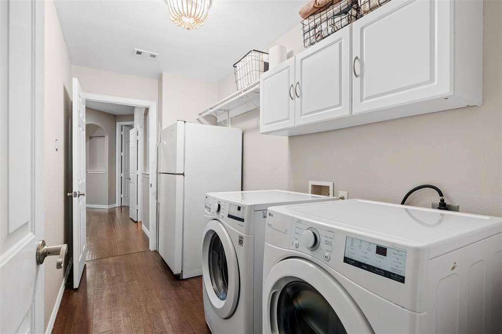 Nice sized laundry room with space for an extra fridge