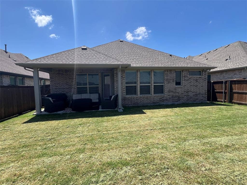 3210 Mattie Grey Lane, Melissa, TX 75454 Rear view of property with an outdoor hangout area, a fenced backyard, and brick siding