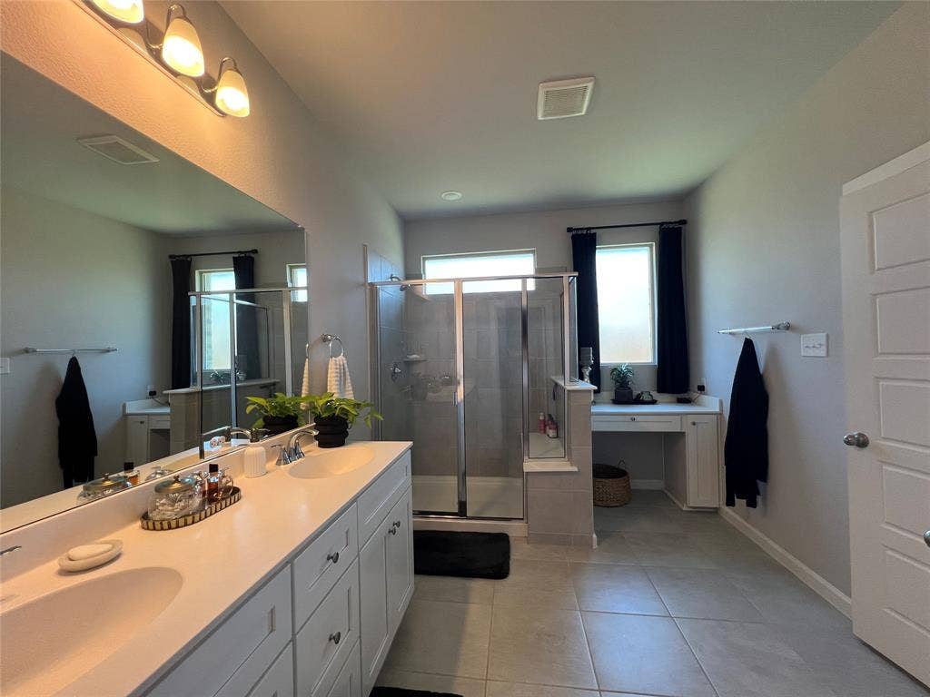 3210 Mattie Grey Lane, Melissa, TX 75454 Full bath with double vanity, a stall shower, and tile patterned flooring