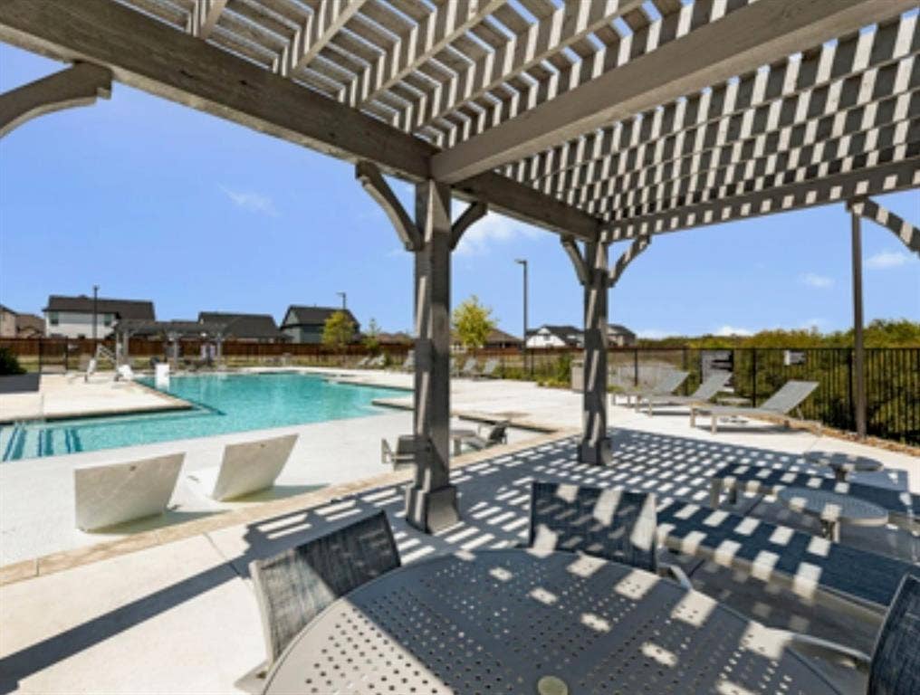 3210 Mattie Grey Lane, Melissa, TX 75454 View of patio with a community pool and a pergola