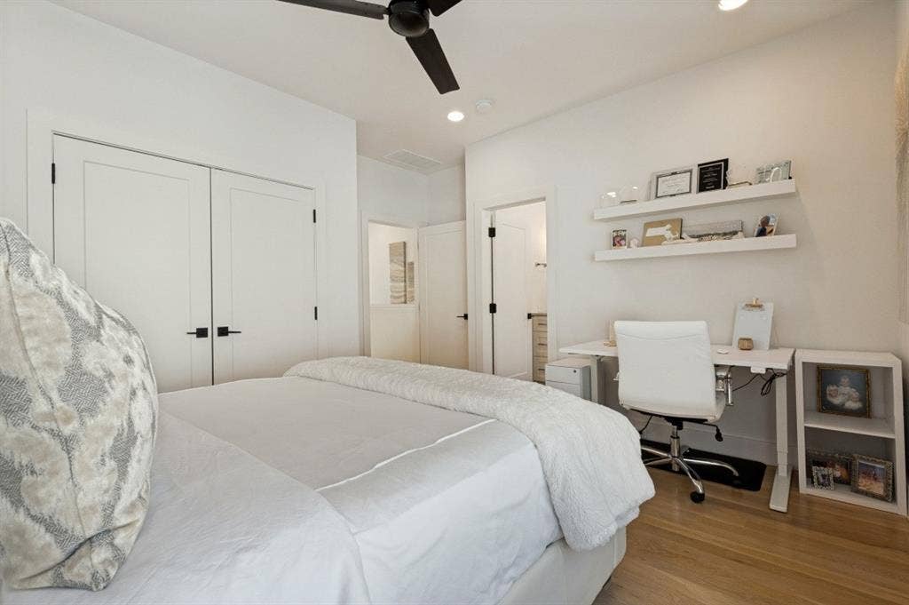 Light wood-finish flooring, recessed lighting, and a ceiling fan
