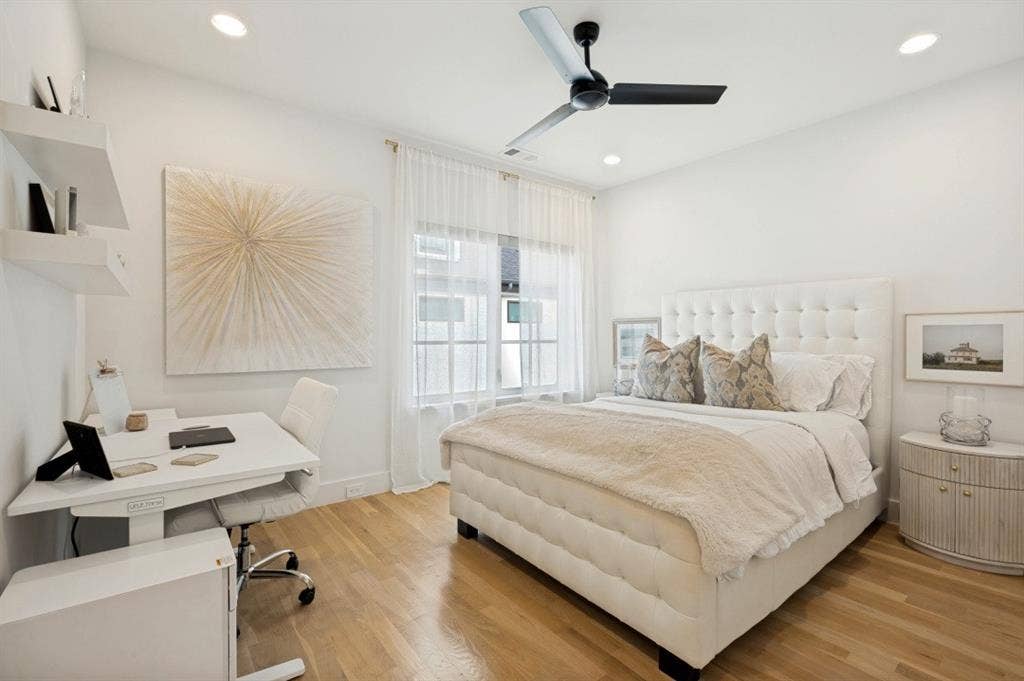 Recessed lighting, wood-finish flooring, and window treatments
