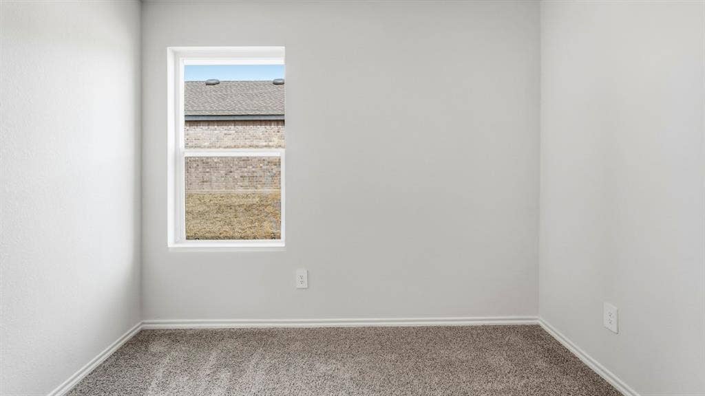 3327 Twilight Trail, Talty, TX 75126 Light gray textured walls, gray carpeting, and a white-framed window