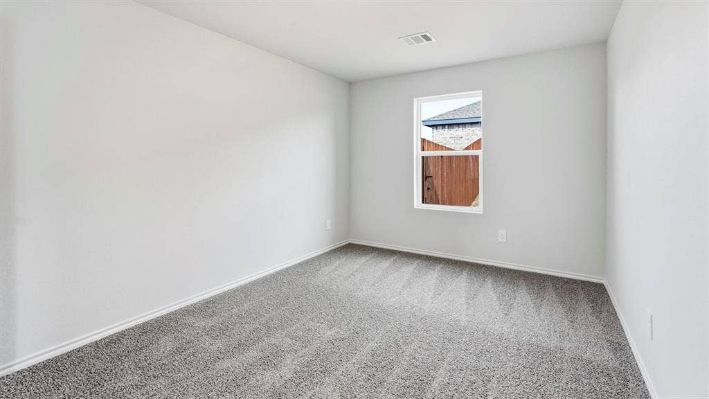 3327 Twilight Trail, Talty, TX 75126 Neutral-toned walls complement the gray carpeted flooring