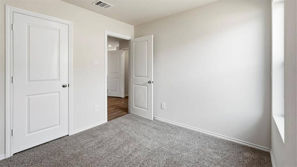 3327 Twilight Trail, Talty, TX 75126 Light grey carpeting with light-colored walls and white trim