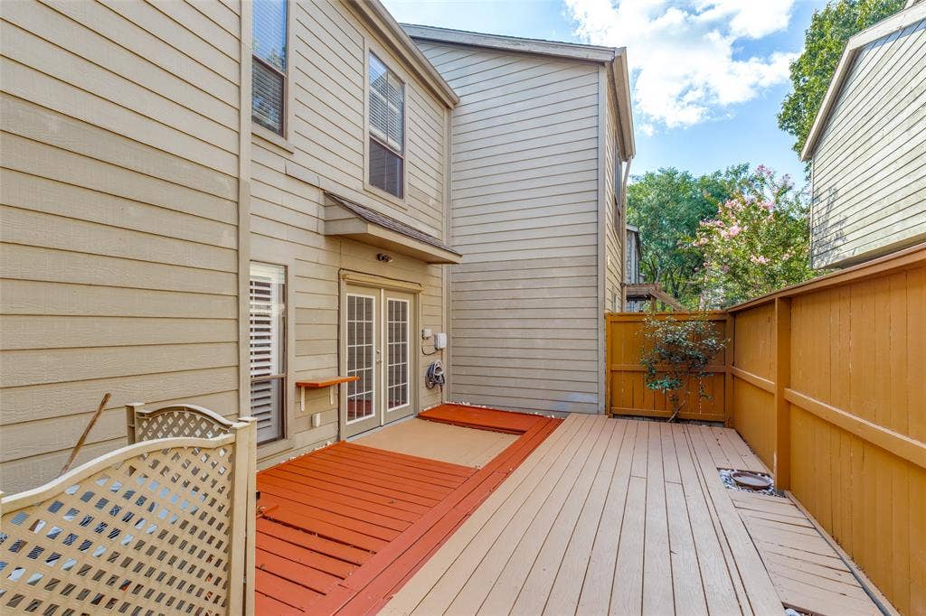 9400 Doliver Drive, #59, Houston, TX 77063 Expansive multi-level wood deck, privacy fencing, and double French doors