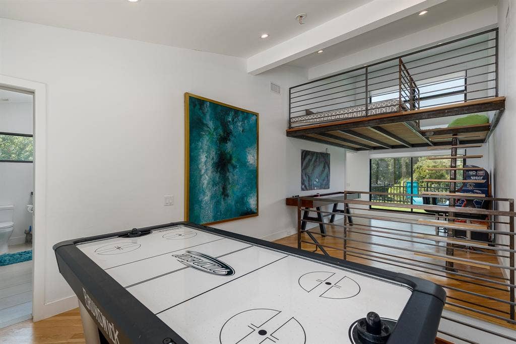 6448 County Road 437, Princeton, TX 75407 High ceilings with recessed lighting, a lofted space featuring metal railings, and wood-finish flooring throughout