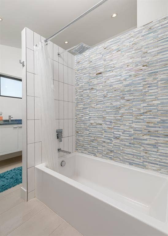 6448 County Road 437, Princeton, TX 75407 White drop-in bathtub with a mosaic tile shower surround