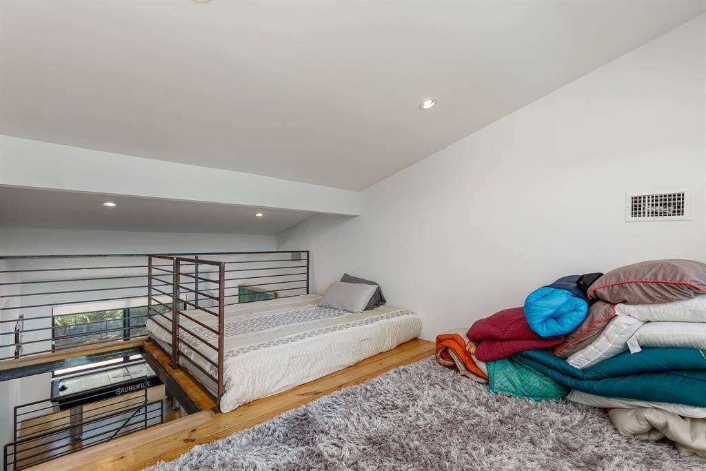 6448 County Road 437, Princeton, TX 75407 Upper level loft space with recessed lighting, exposed wood beams, and metal railing