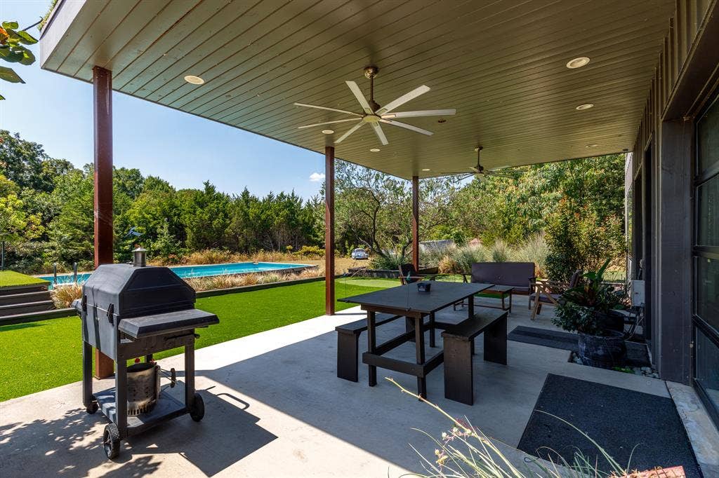 6448 County Road 437, Princeton, TX 75407 Covered patio with integrated ceiling fans, recessed lighting, and expansive concrete flooring