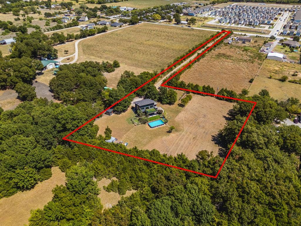 6448 County Road 437, Princeton, TX 75407 Expansive property featuring a modern residence, a rectangular swimming pool, and extensive tree coverage, with open land parcels