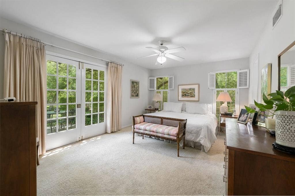 13828 Hillcrest Road, Dallas, TX 75240 Primary Bedroom with French Doors for views of private back yard.
