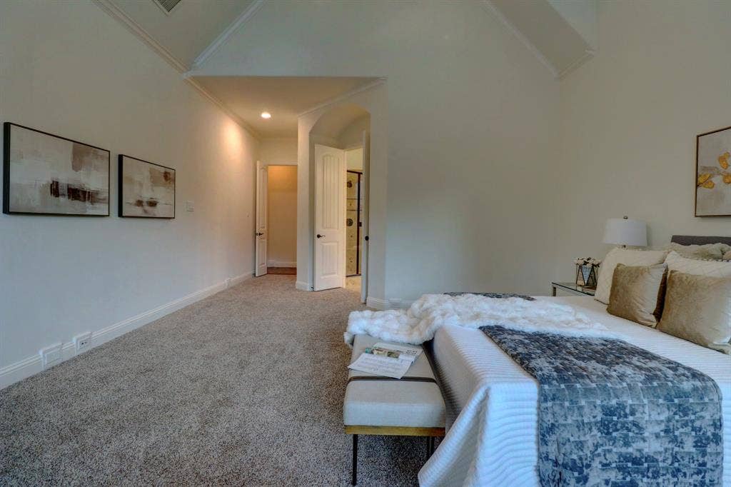 11559 Ashley Lane, Frisco, TX 75035 Tray ceiling, recessed lighting, arched doorway, carpeted flooring, white paneled doors