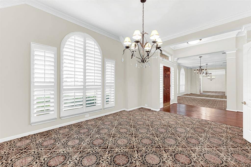 3217 Royal Melbourne Drive, Plano, TX 75093 This angle showcases the gracious open layout connecting the dining room to the grand foyer and front entryway. Guests will feel instantly welcomed as they transition seamlessly from the front door into warm, lively dinner celebrations.