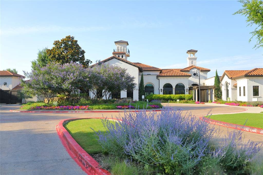 3707 Plum Vista Place, Arlington, TX 76005 Mediterranean-style architecture featuring white stucco, red tile roofing, and arched windows