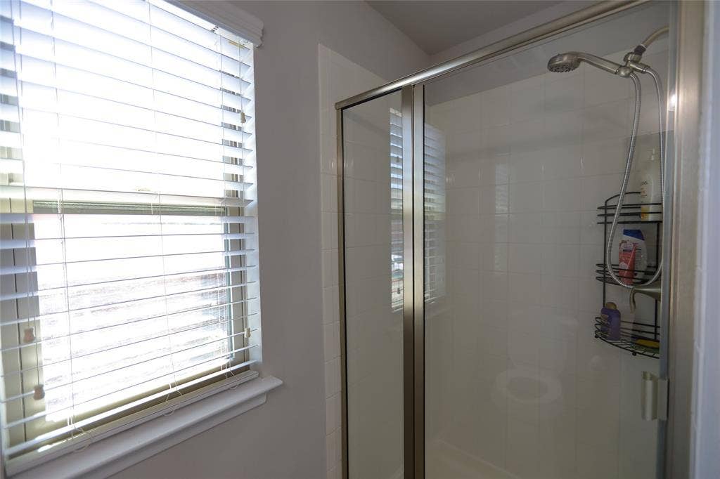 3707 Plum Vista Place, Arlington, TX 76005 Shower stall featuring a glass enclosure and a handheld showerhead