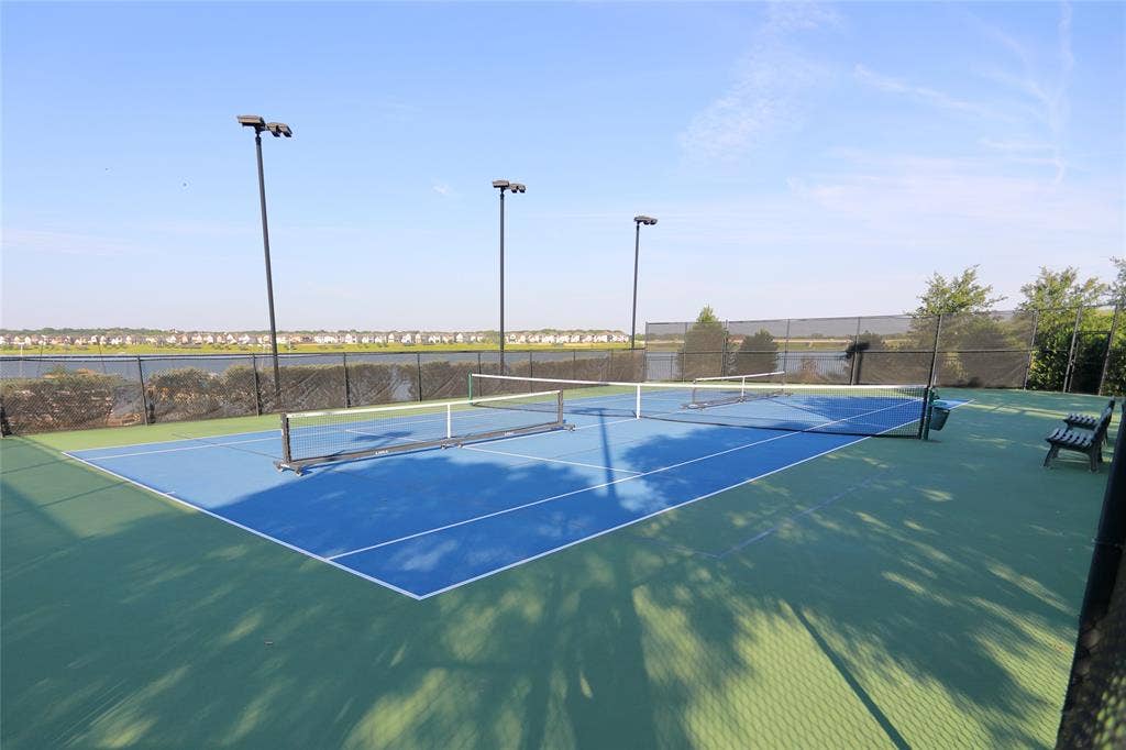 3707 Plum Vista Place, Arlington, TX 76005 Two outdoor tennis courts featuring blue and green hard surfaces