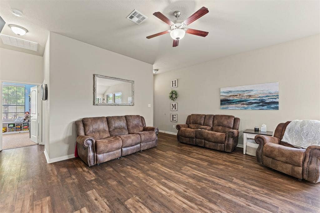 10313 Condor Loop, Waco, TX 76708 Wood-finish flooring throughout, ceiling fan with integrated lighting, recessed lighting, and neutral wall tones