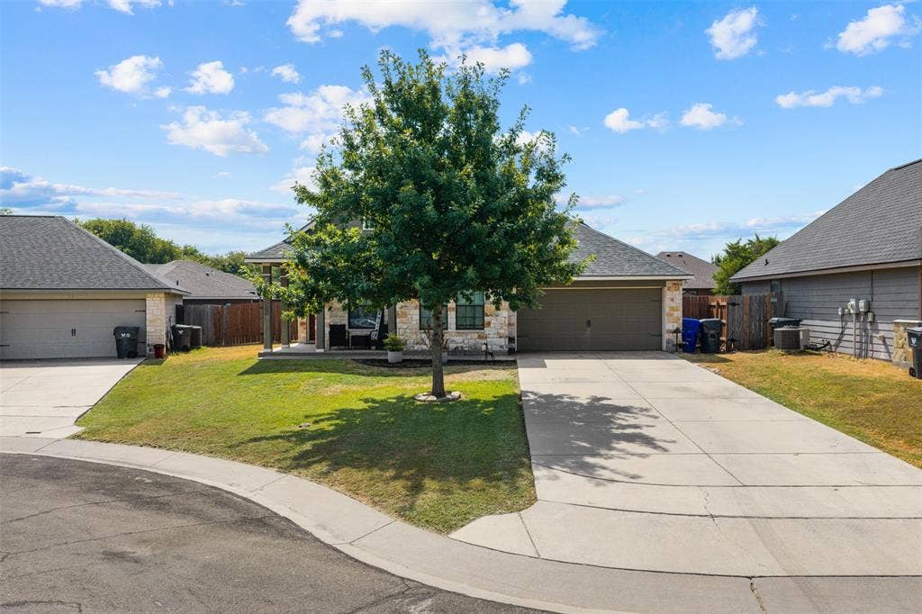 10313 Condor Loop, Waco, TX 76708 Stone and siding exterior with a dark shingle roof