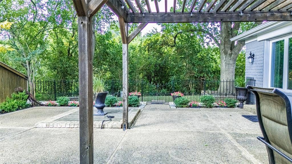 3613 Windmill Hill Street, Waco, TX 76710 Patio with a wood pergola, concrete surface, and surrounding landscaping