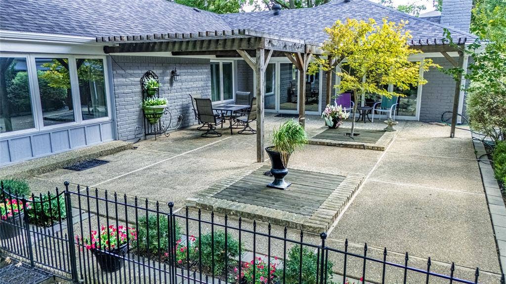 3613 Windmill Hill Street, Waco, TX 76710 Expansive outdoor patio with concrete surfacing and decorative brick accents